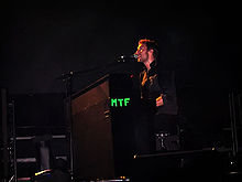 220px-Coldplay_Twisted_Logic_Live_2006_in_Singapore_Indoor_Stadium.jpg