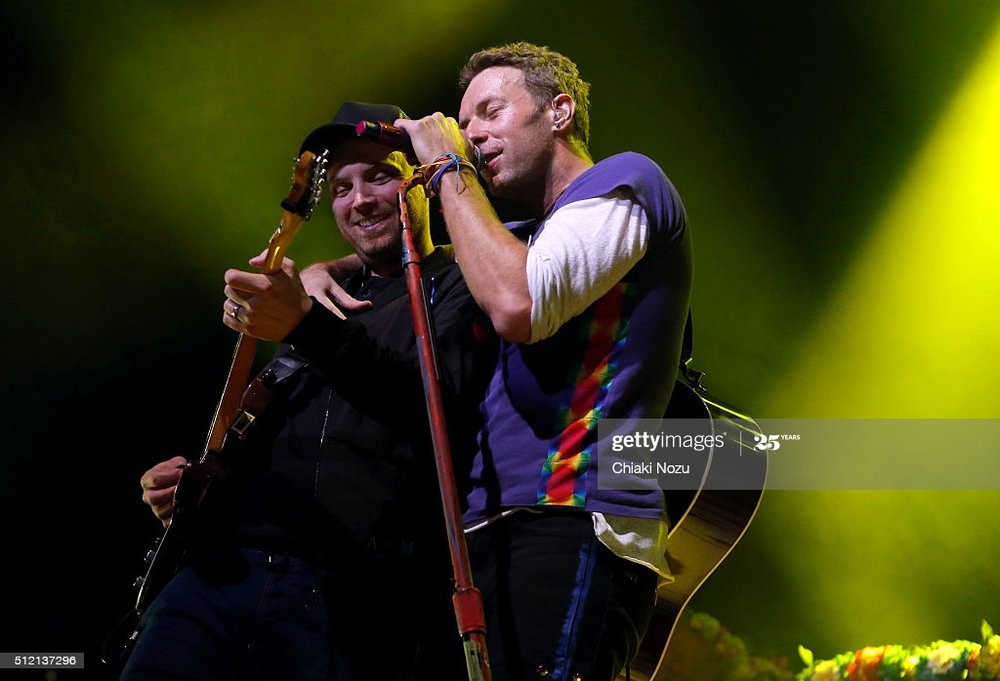 jonny-buckland-and-chris-martin-of-coldplay-perform-during-passport-picture-id512137296
