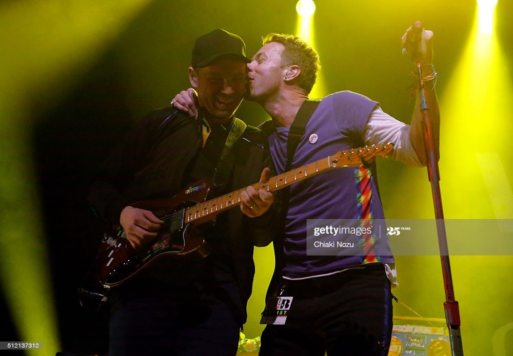 jonny-buckland-and-chris-martin-of-coldplay-perform-during-passport-picture-id512137312