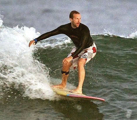 chrismartinsurfing.jpg